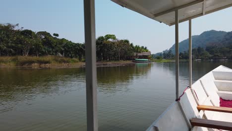 4k daytime video slowly revealing an amazing panoramic view of the lake named laguna de los milagros in the city of tingo maria, the amazonian river