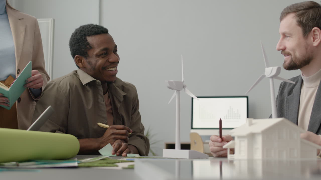 Multiethnic Business Team Discussing About Renewable Energy Project In The Office 5