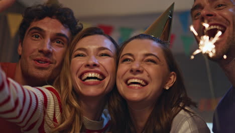 group taking photo birthday party on smartphone close up. people making selfie