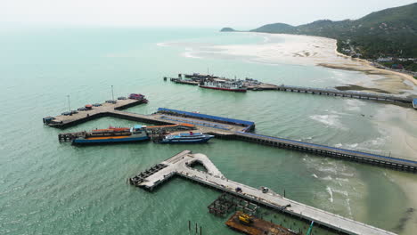 Slow-Aerial-Rotation-Over-Nathon-Pier-In-Koh-Samui,-Thailand