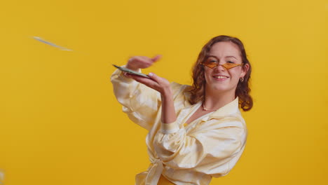 woman showing wasting throwing money around more tips big profit winning lottery jackpot shopping