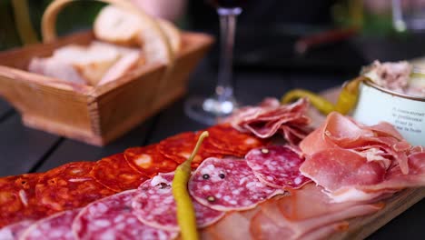 hand reaching for food on charcuterie board