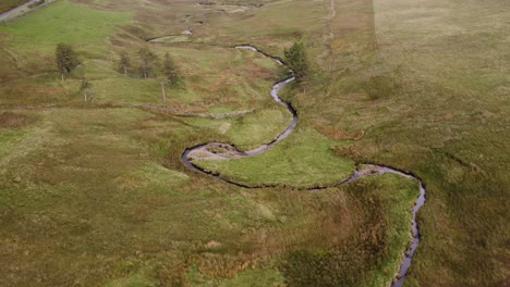 circling round a natural stream in the heart of the lake district during the summer