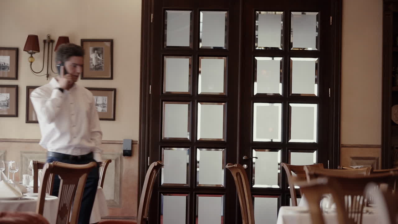 Man talking on phone in a restaurant