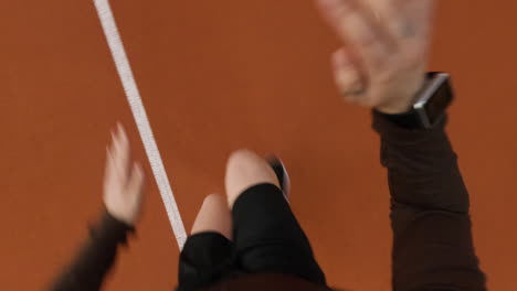 first-person view of a person running on an athletic track