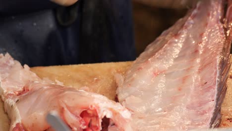 fish filleting at a market