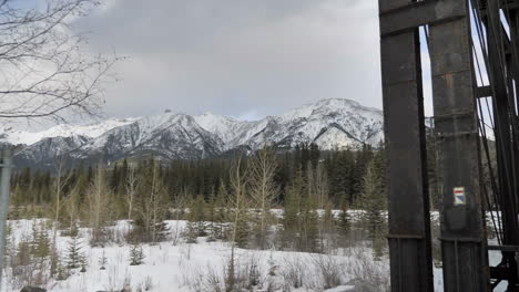 cinematic push in of mountain range in winter.