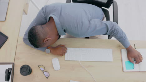 top view, black man and sleeping at desk