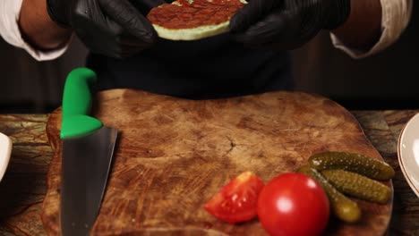 chef preparing a gourmet burger