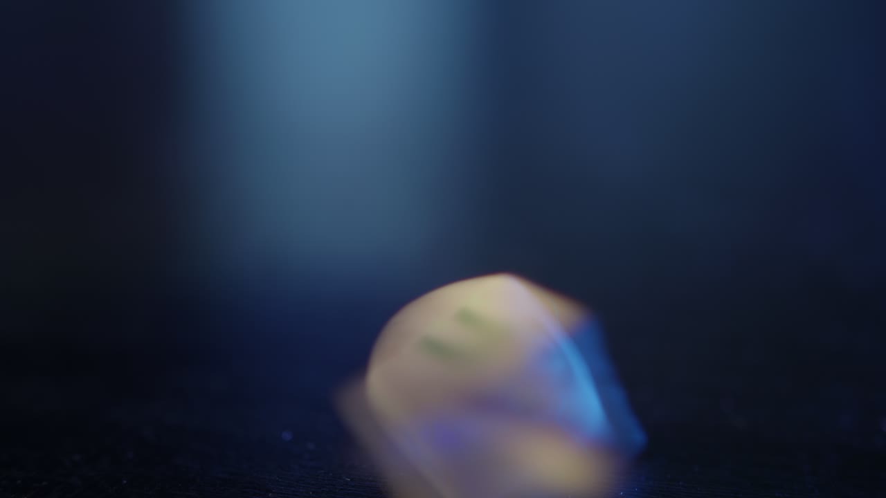 Wooden Dreidel Spinning and Coming to Rest on Dark Background