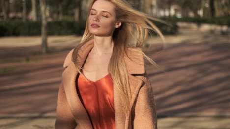 young woman walking outdoors.