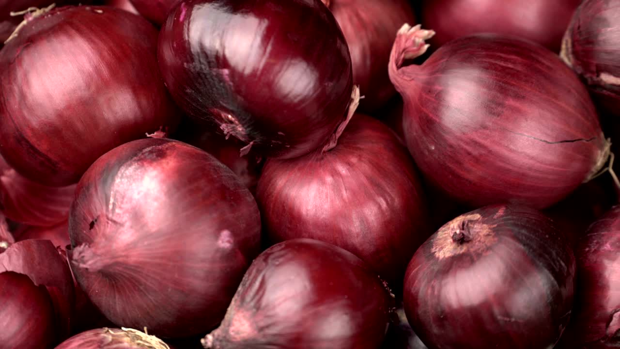 fondo de cebollas rojas giratorias