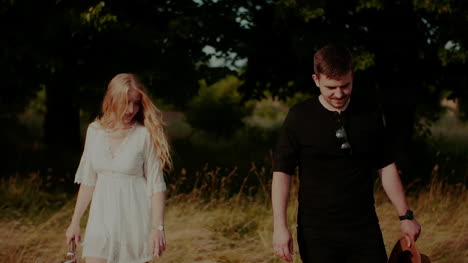 Boho-Couple-Walk-In-Forest-In-Summer