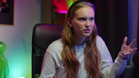 young woman streaming video games at her desk