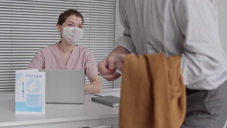female medical worker registering patients