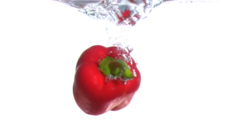 Pepper-falling-into-water-in-super-slow-motion