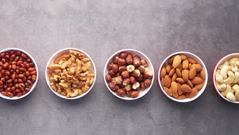 assorted nuts in small bowls