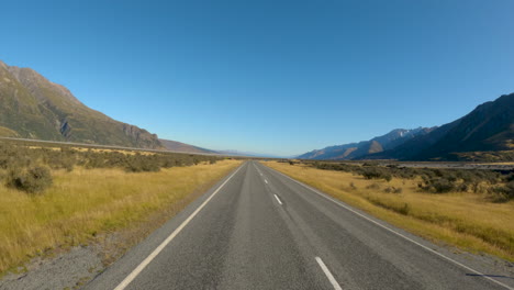 asphalt country road near omarama in otago, south island, new zealand