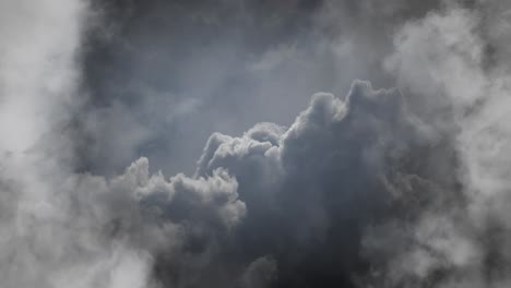 cumulus clouds, plumes of dark gray clouds and thunderstorms are moving closer