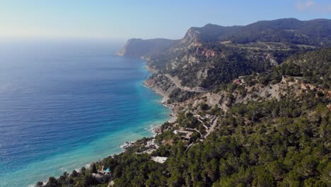 Drone-shot-moving-forwards-on-Ibiza-by-the-coast-line