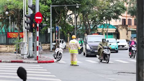 traffic officer managing busy hanoi intersection