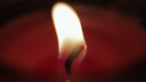 a candle's flame dances before being blown out