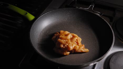 cooking skinless and boneless chicken breast in a skillet