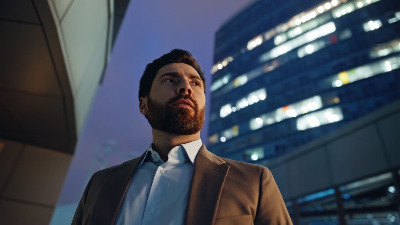 Satisfied business leader looking distance standing evening district closeup