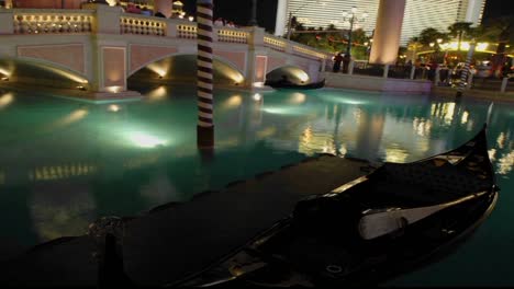 a time lapse of gondolas moving through water at night