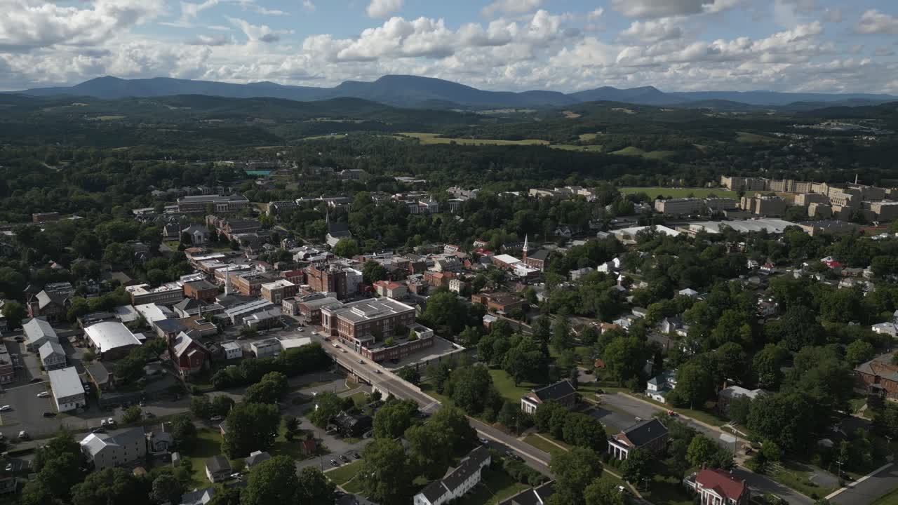 Bird's-eye cityscape with architectural buildings, green plants, and serene suburban landscape