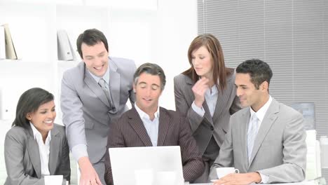 business team applauding a colleague in office