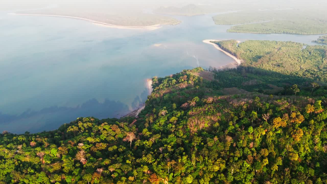 Thailand Expansive aerial pullback above forested mountains and coastal landscapes, Laem Son National Park