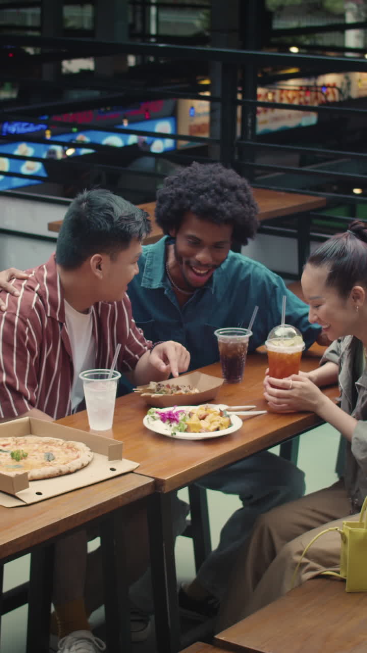Friends Having Street Food for Lunch in Food-court