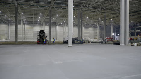 concrete pouring in a large warehouse