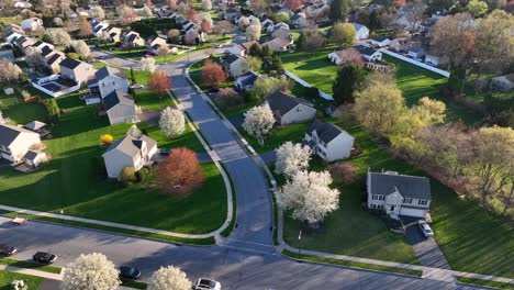 Aerial-tilt-up-reveal-of-beautiful-neighborhood-during-spring-in-USA