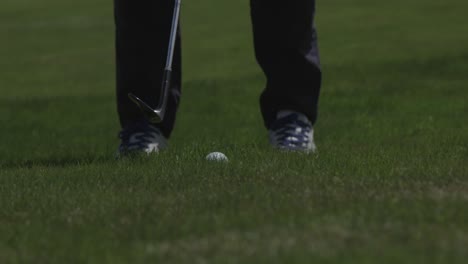 hitting a golf ball. close up. slow motion