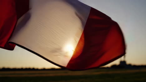 italian flag waving in sunset