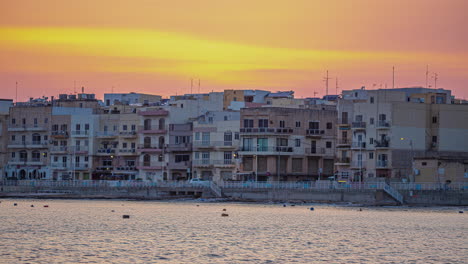 sunset over the coastline of gzira in the central region of malta