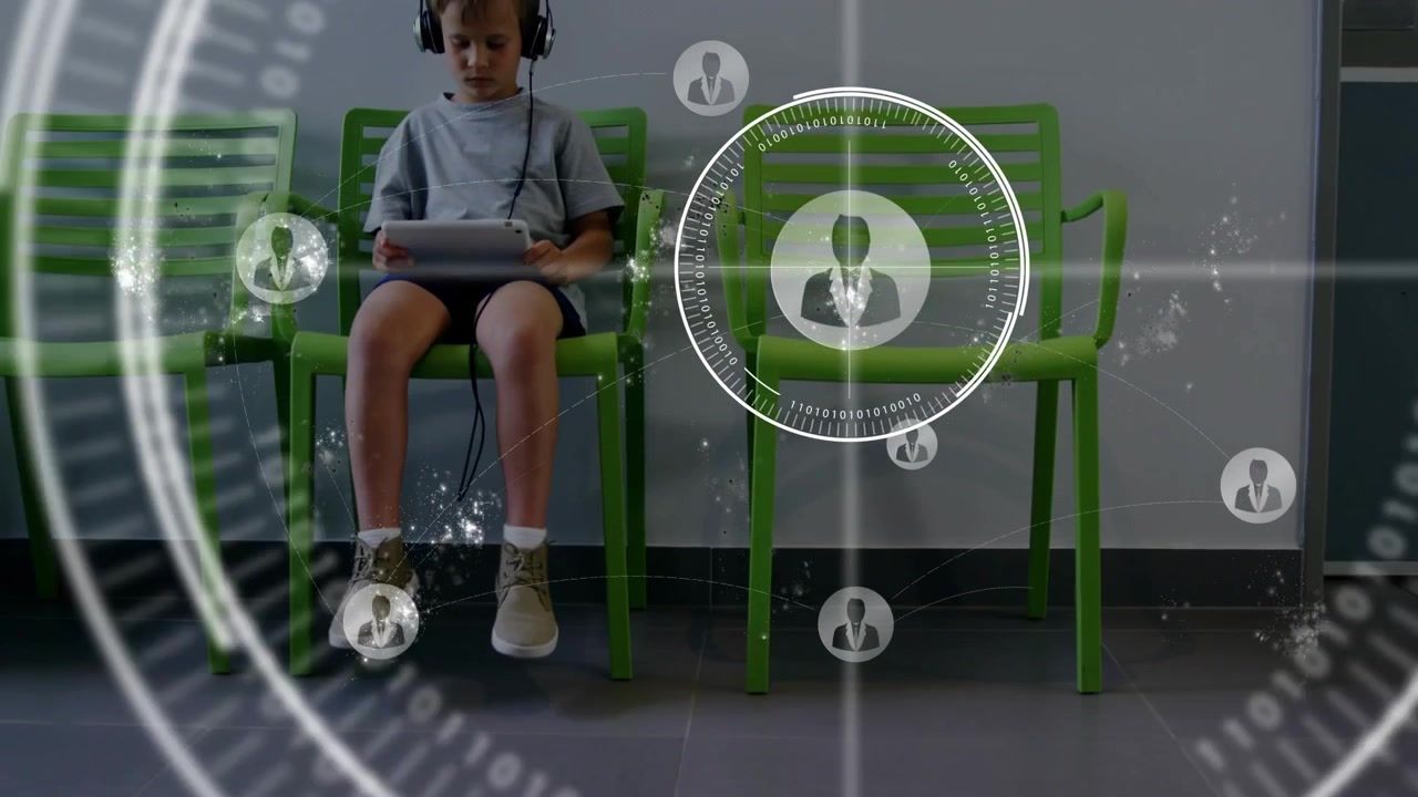 Boy walking into green chairs lobby tapping tablet and displaying tech holographic network icons