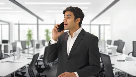 indian manager talking to someone on call