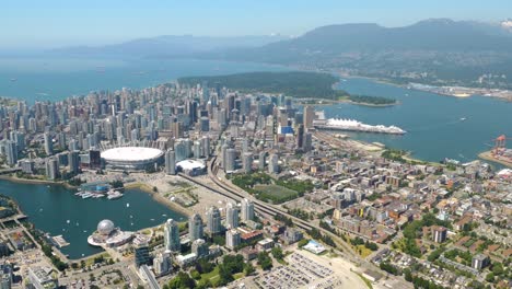 Aerial-shot-of-Vancouver,-BC,-Canada-looking-over-city-scape-towards-west-Vancouver
