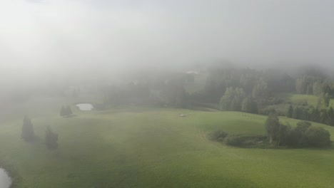 flying through clouds in the morning. countryside aerial
