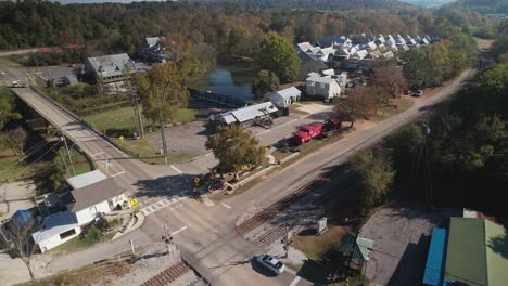 aerial approaching waterfall surrounded by shops and suburbs in old town helena, alabama