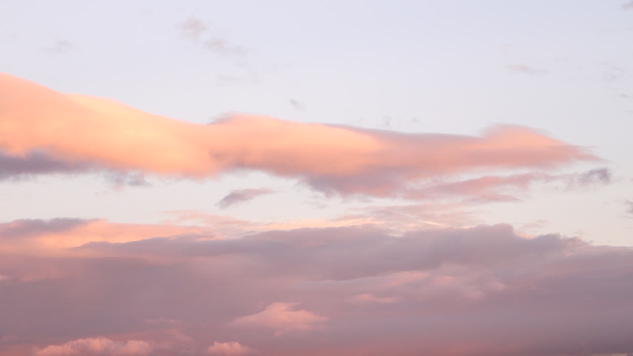 contrast of dark clouds over sunset sky