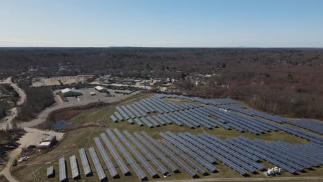 Aerial-flyover-of-solar-panel-farm-next-to-Widow's-Walk-golf-course-in-Scituate
