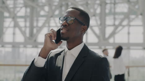 businessman on a phone call in a modern building
