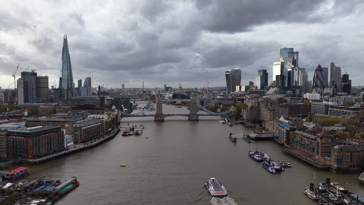 Aerial drone video of London, Tower Bridge, the River Thames, and the city skyline