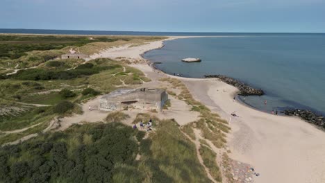 aerial pan of nazi wwii bunker on beach, grenen, skagen, denmark