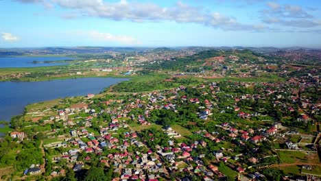 Panoramic-Aerial-View-Of-Residential-Villages-On-The-Coast-Of-Lake-Victoria,-Uganda,-Africa