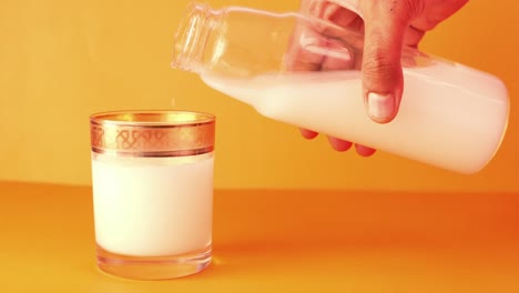 pouring milk into a glass